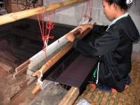 woman weaving silk in korat province